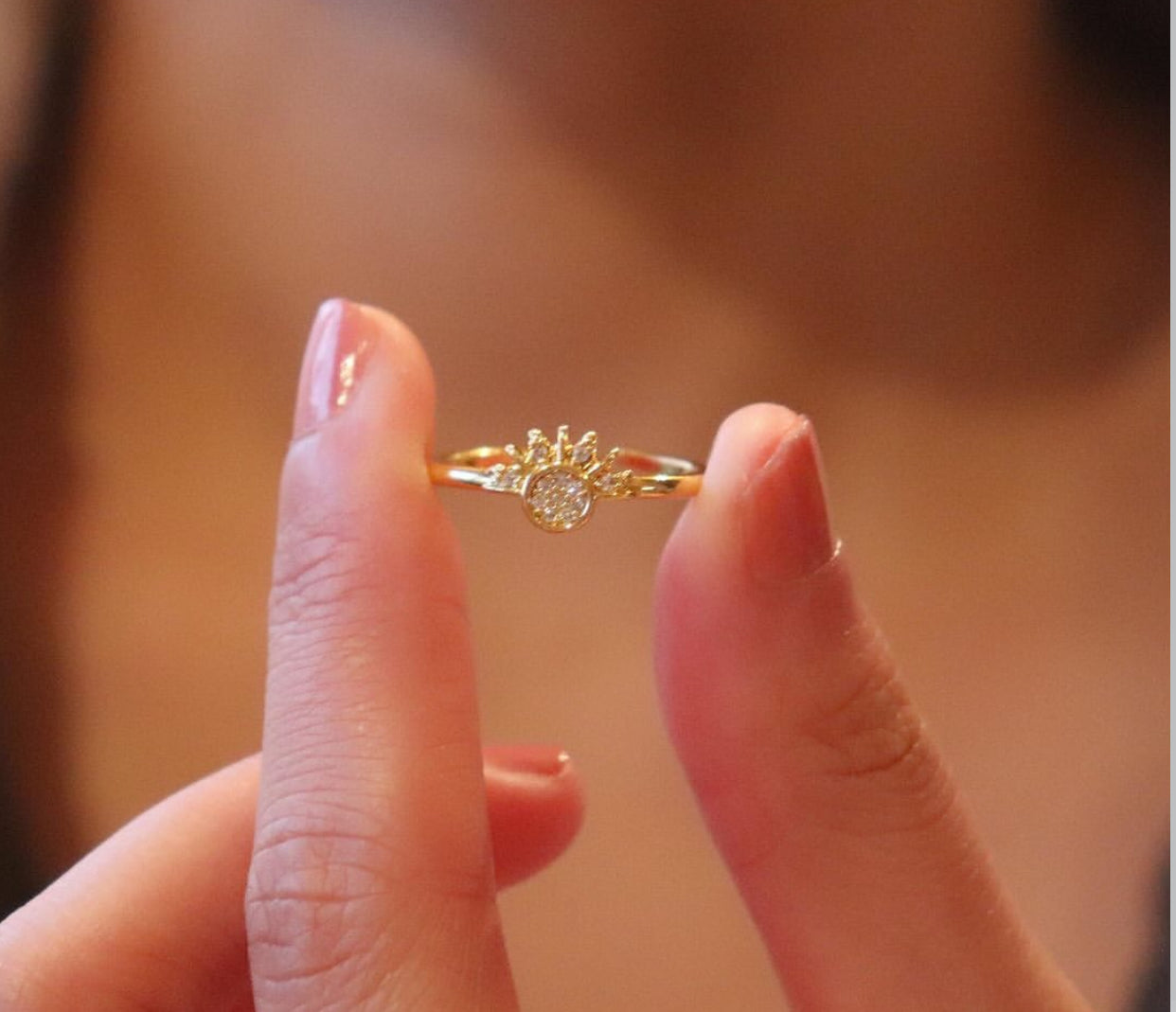 A Sun and Moon silver ring with a design